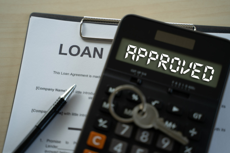 A loan application and calculator that has approved across the output area.